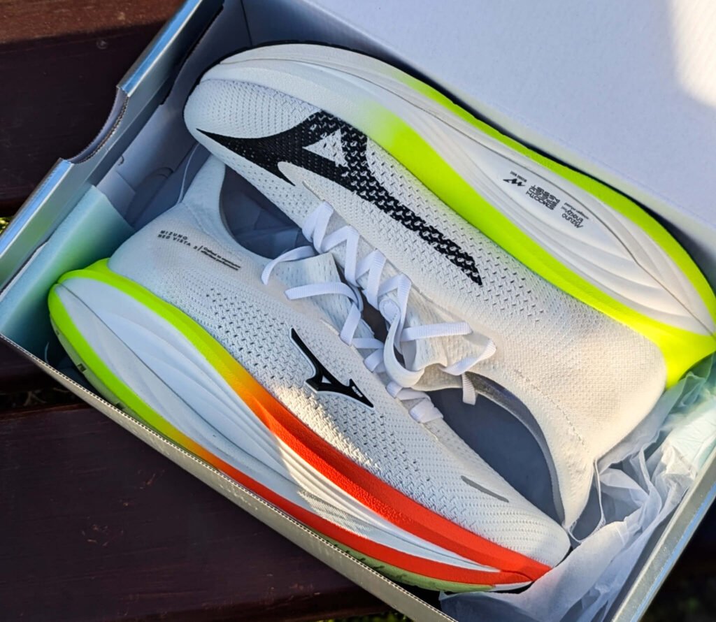 Mizuno neo vista 3 with neon yellow-green and orange accents inside an open shoebox.